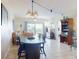 Open-concept living and dining area with access to a balcony with scenic views at 5300 S Atlantic Ave # 6-206, New Smyrna Beach, FL 32169