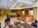 Spacious club room with large stone fireplace and ample seating at 5300 S Atlantic Ave # 6-206, New Smyrna Beach, FL 32169