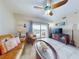 Comfortable living room with modern furnishings, tile floors, and access to a private outdoor balcony at 5300 S Atlantic Ave # 6-206, New Smyrna Beach, FL 32169