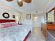 Bright main bedroom with decorative mirror and ensuite bathroom at 5300 S Atlantic Ave # 6-206, New Smyrna Beach, FL 32169