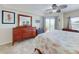 Comfortable main bedroom with a dresser, mirror, and balcony access at 5300 S Atlantic Ave # 6-206, New Smyrna Beach, FL 32169