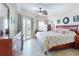 Spacious bedroom with tiled floors, balcony access, and tasteful décor for comfort at 5300 S Atlantic Ave # 6-206, New Smyrna Beach, FL 32169