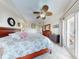 Bright main bedroom with ceiling fan, balcony access, and beautiful furnishings at 5300 S Atlantic Ave # 6-206, New Smyrna Beach, FL 32169