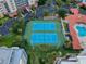 Aerial view of tennis courts with adjacent community pool at 5300 S Atlantic Ave # 6-206, New Smyrna Beach, FL 32169