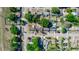 Aerial view of a property with a red outline, showcasing its location and surrounding neighborhood with mature trees at 5508 Meridian Way, Orlando, FL 32808