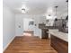 Open kitchen with granite countertops and stainless steel appliances at 5508 Meridian Way, Orlando, FL 32808