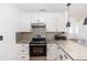 Kitchen with stainless steel appliances, granite countertops, and white cabinetry at 5508 Meridian Way, Orlando, FL 32808