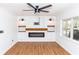 Inviting living room with fireplace, custom built-ins, and modern lighting at 5508 Meridian Way, Orlando, FL 32808