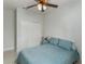 Cozy bedroom features a ceiling fan and a closet for ample storage space at 619 Meadow Sage Dr, Deland, FL 32724