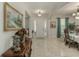 Bright and airy front foyer featuring tile flooring and a beautiful chandelier at 619 Meadow Sage Dr, Deland, FL 32724