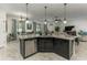 Modern kitchen featuring a dark island with a stainless steel dishwasher at 619 Meadow Sage Dr, Deland, FL 32724