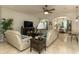 Open concept floor plan featuring tile flooring, a ceiling fan, and comfortable furniture at 619 Meadow Sage Dr, Deland, FL 32724