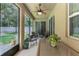 Relaxing screened porch with ceiling fan offers serene outdoor living at 619 Meadow Sage Dr, Deland, FL 32724