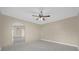 Spacious bedroom featuring tile flooring, neutral paint, and a ceiling fan at 6209 Beaumont Ave, Orlando, FL 32808