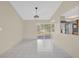Bright living area featuring tile flooring, neutral paint, and sliding glass doors at 6209 Beaumont Ave, Orlando, FL 32808