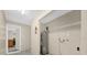 A functional utility room features modern water heater, shelving, and neutral wall paint at 6209 Beaumont Ave, Orlando, FL 32808