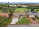 Aerial view of the home showing the landscaped yard, surrounding neighborhood, and proximity to local amenities at 6766 Edgeworth Dr, Orlando, FL 32819
