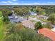 Lush green neighborhood, mature tree coverage, and a sprawling golf course at 6766 Edgeworth Dr, Orlando, FL 32819