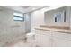 Bathroom with granite countertops, vanity, glass shower, and tile flooring at 6766 Edgeworth Dr, Orlando, FL 32819