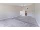 Spacious carpeted bedroom with tall ceilings and a ceiling fan at 6766 Edgeworth Dr, Orlando, FL 32819