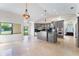Large kitchen featuring a center island, recessed lighting, and stainless steel appliances at 6766 Edgeworth Dr, Orlando, FL 32819
