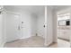 Laundry room with tile flooring and entry to the bathroom at 6766 Edgeworth Dr, Orlando, FL 32819