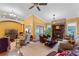 Spacious living room featuring a fireplace, tile floors, and sliding glass doors to the backyard at 6766 Edgeworth Dr, Orlando, FL 32819