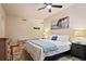 Relaxing bedroom showcasing a ceiling fan, soft carpet, and a stylish headboard for ultimate comfort at 911 N Orange Ave # 148, Orlando, FL 32801
