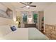 Comfortable bedroom features a ceiling fan, stylish dresser, and serene decor for a relaxing retreat at 911 N Orange Ave # 148, Orlando, FL 32801