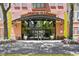 Stunning entrance to Uptown Place with lush landscaping and a welcoming, modern design at 911 N Orange Ave # 148, Orlando, FL 32801