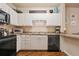 Well-equipped kitchen with white cabinetry and stainless steel appliances, perfect for meal preparation at 911 N Orange Ave # 148, Orlando, FL 32801