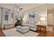 Bright living room featuring a ceiling fan, comfortable sofa, and stylish decor, creating a cozy atmosphere at 911 N Orange Ave # 148, Orlando, FL 32801