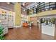 Stylish office space with hardwood floors, white shelving, and comfortable seating at 911 N Orange Ave # 148, Orlando, FL 32801