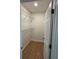 Walk-in closet with shelves, recessed lighting, and new flooring at 1007 Colyer St, Orlando, FL 32805