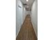 Long hallway with light wood floors, a white door, and recessed lighting at 1007 Colyer St, Orlando, FL 32805