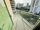 Balcony with views of other buildings and trees at 101 S Eola Dr # 921, Orlando, FL 32801