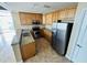 Condo kitchen with granite counters, stainless steel appliances and tile floors at 101 S Eola Dr # 921, Orlando, FL 32801