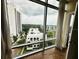 Stunning city views from the large windows, showcasing the vibrant cityscape and lush greenery at 101 S Eola Dr # 921, Orlando, FL 32801