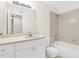 Bright bathroom featuring a tub/shower combo, a white vanity, and a large mirror at 1043 S Hiawassee Rd # 3125, Orlando, FL 32835