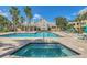 Resort-style community pool and spa surrounded by manicured landscaping at 1043 S Hiawassee Rd # 3125, Orlando, FL 32835