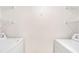 A functional laundry room with white appliances and wire shelving for storage solutions at 1043 S Hiawassee Rd # 3125, Orlando, FL 32835