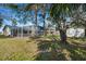 Spacious backyard with screened pool and an outbuilding at 1157 Schooner Dr, Kissimmee, FL 34744