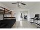 Bedroom with a bunkbed, desk, ceiling fan and mirrored closet at 1157 Schooner Dr, Kissimmee, FL 34744