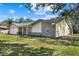 Exterior side view of the home, showcasing the brick and siding details at 1157 Schooner Dr, Kissimmee, FL 34744