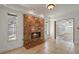 Living room featuring tiled floors, a marble fireplace, and a view into the backyard at 1157 Schooner Dr, Kissimmee, FL 34744