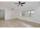 Bright living area with tile floors, a window, recessed lighting, and a modern ceiling fan at 1157 Schooner Dr, Kissimmee, FL 34744