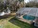 Backyard with a screened pool and additional storage shed at 1157 Schooner Dr, Kissimmee, FL 34744