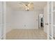 Bright, tiled room with white walls and French doors at 1157 Schooner Dr, Kissimmee, FL 34744