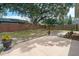 Large, fenced backyard featuring a patio and mature trees at 1188 La Mesa Ave, Winter Springs, FL 32708