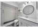 Bathroom features white subway tile in the shower, grey tile flooring, floating shelves and new vanity at 1188 La Mesa Ave, Winter Springs, FL 32708